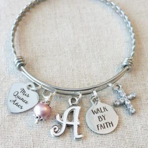 Silver bangle bracelet with Mis Quince Anos, pearl, initial, Walk by Faith, and cross charms
